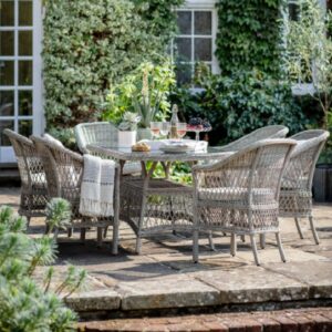 Maxton Outdoor Glass Top 6 Seater Oval Dining Set In Stone